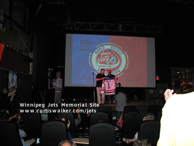 Tim Gassen presents Joe Daley with his WHA HOF jersey