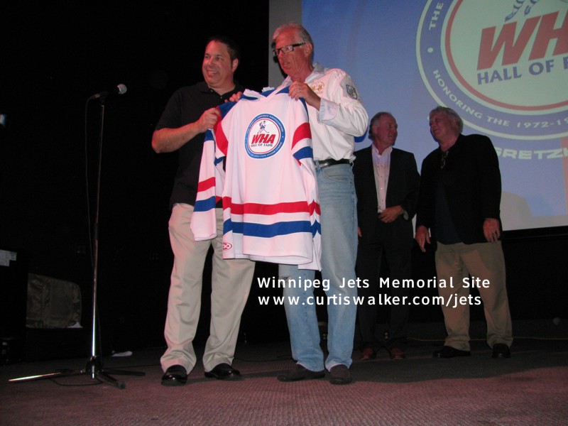 Tim Gassen presents Ulf Nilsson with his WHA HOF jersey
